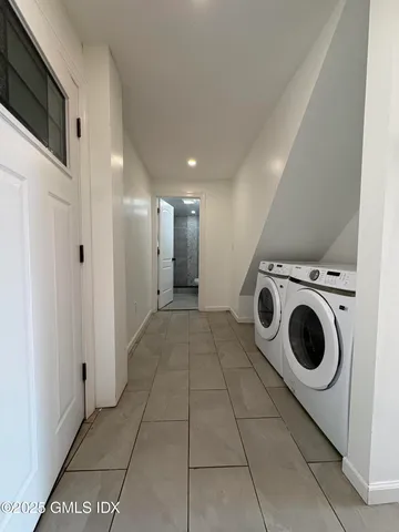 a view of a storage & utility room with washer and dryer