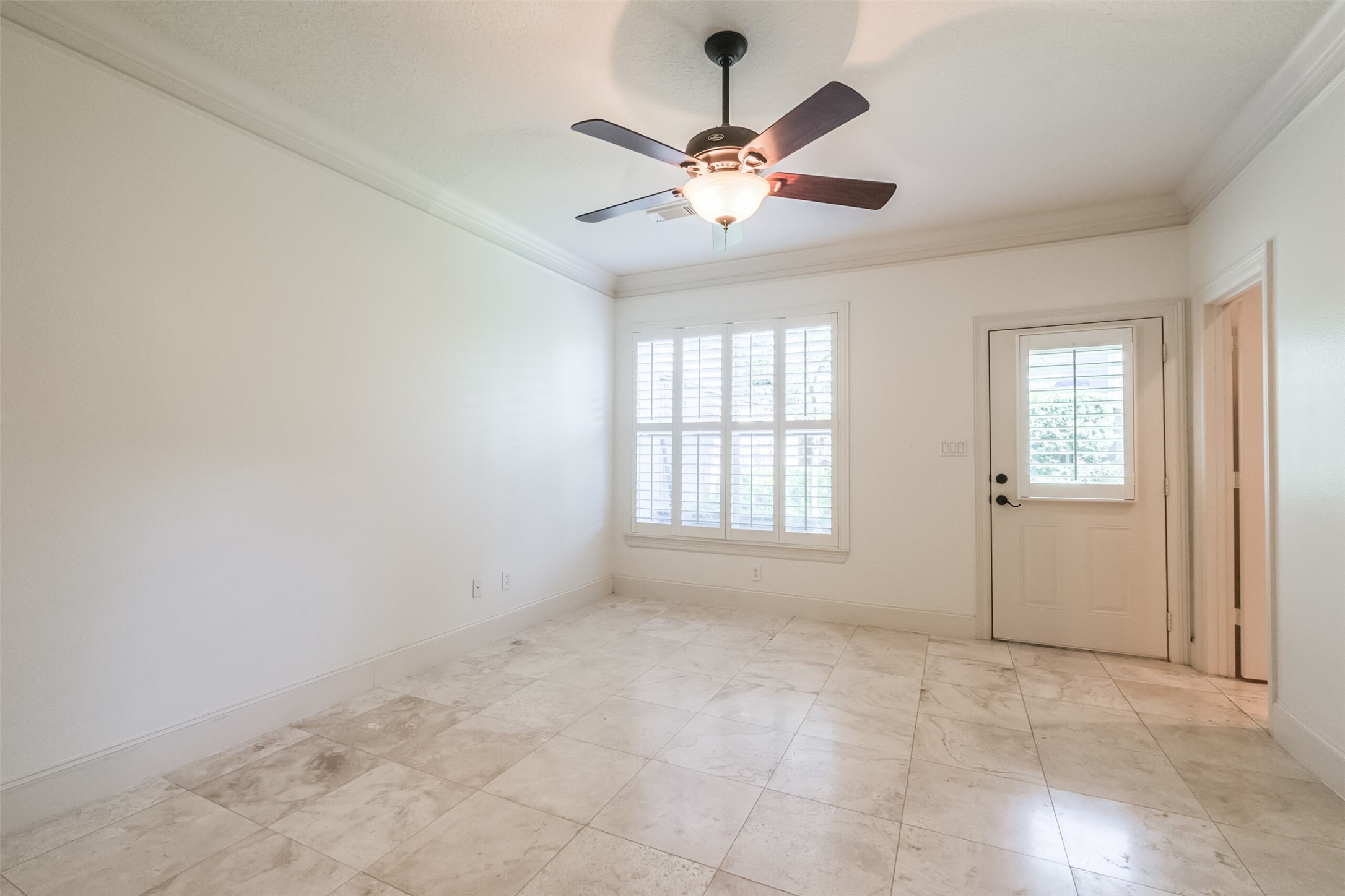 407 West Bell Street Houston, TX 77019 - Photo 11 of 49 an empty room with chandelier fan and windows