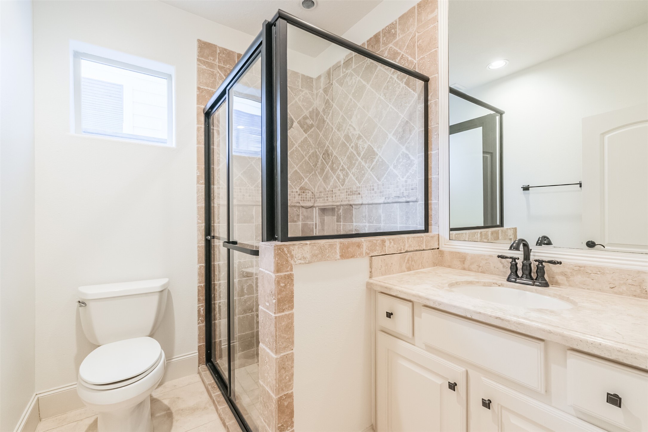 407 West Bell Street Houston, TX 77019 - Photo 12 of 49 a bathroom with a sink a toilet and a mirror