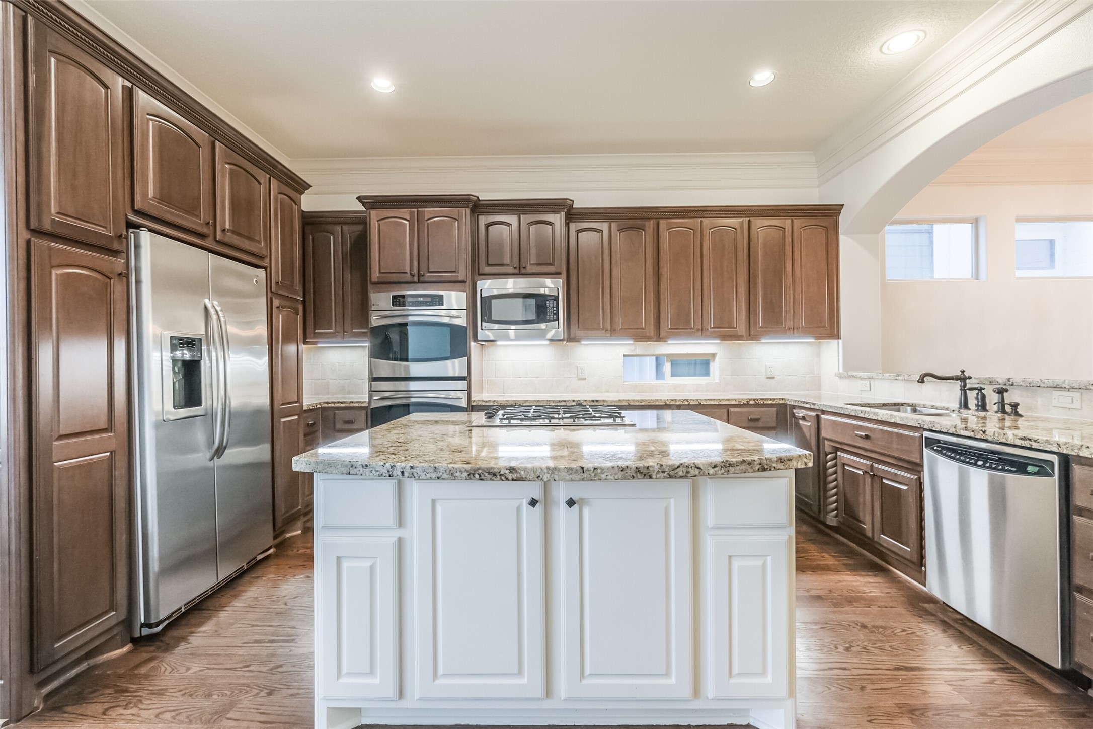 407 West Bell Street Houston, TX 77019 - Photo 24 of 49 a kitchen with stainless steel appliances granite countertop a stove a refrigerator and a sink