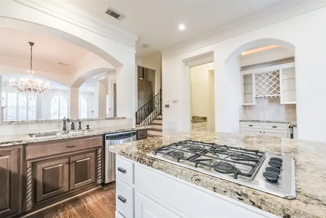 a view of a kitchen counter space and a stove top oven