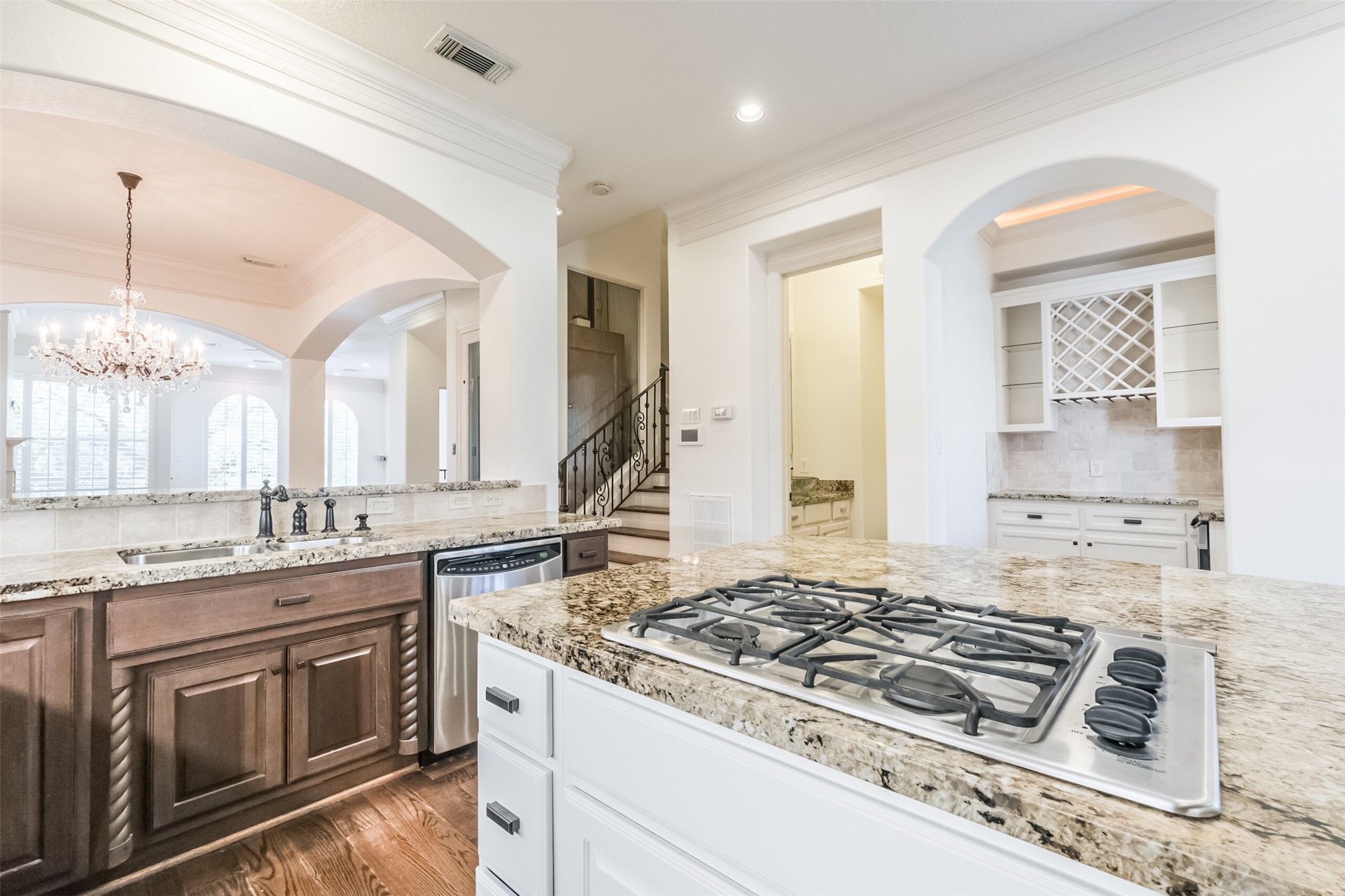 407 West Bell Street Houston, TX 77019 - Photo 27 of 49 a kitchen with kitchen island granite countertop a sink stove and cabinets
