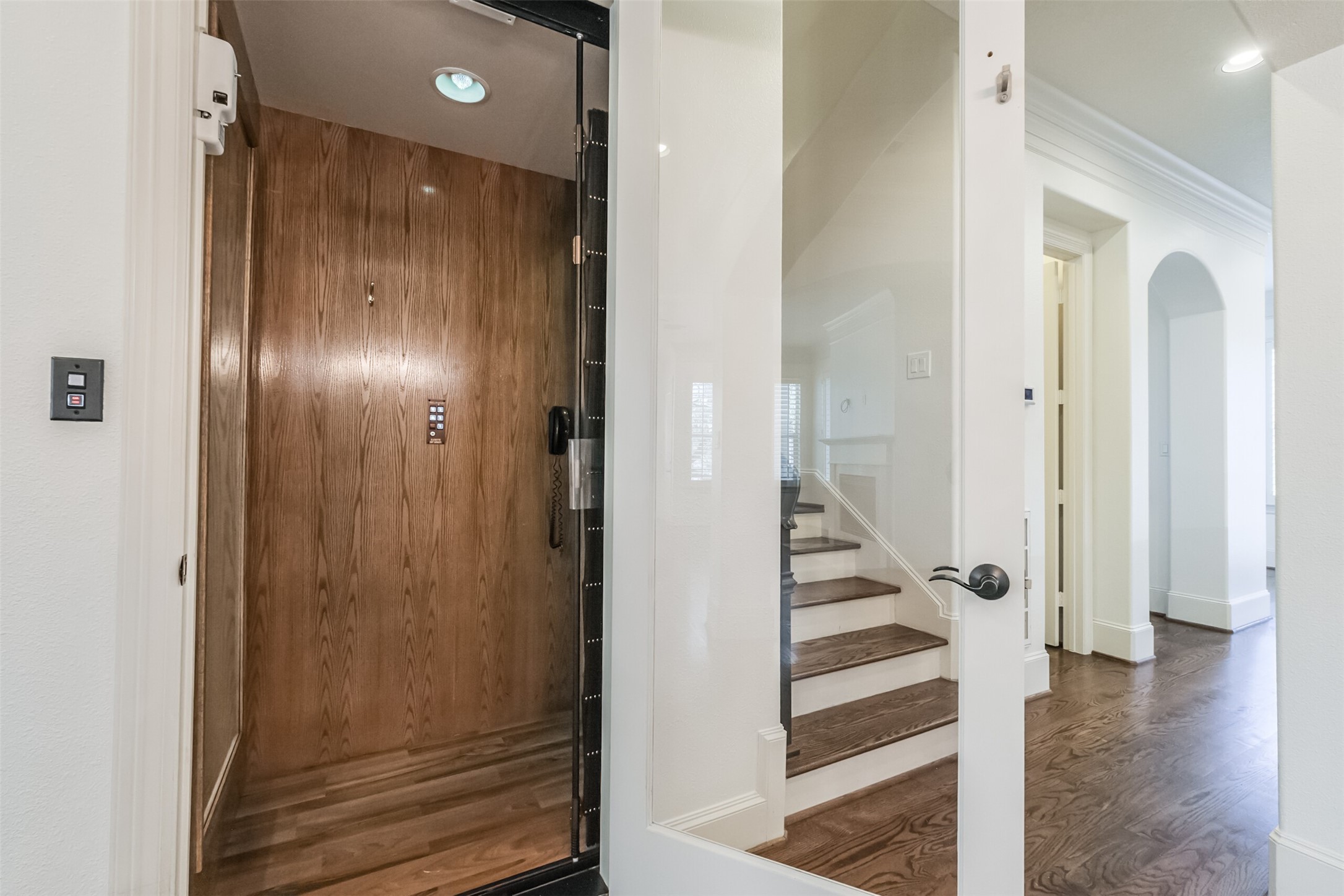 407 West Bell Street Houston, TX 77019 - Photo 32 of 49 a view of a hallway with wooden floor and staircase