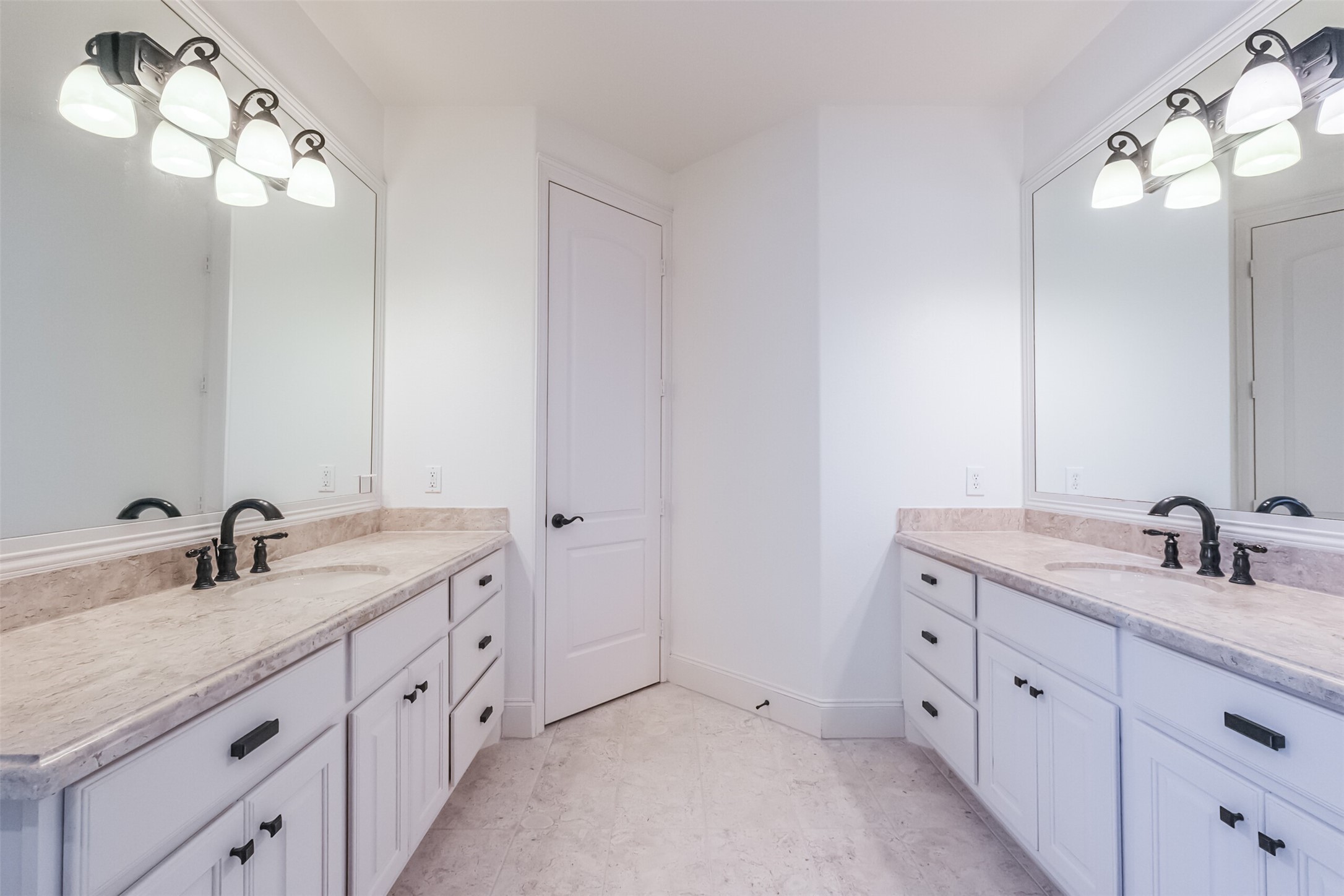 407 West Bell Street Houston, TX 77019 - Photo 40 of 49 a bathroom with a double vanity sink and a mirror