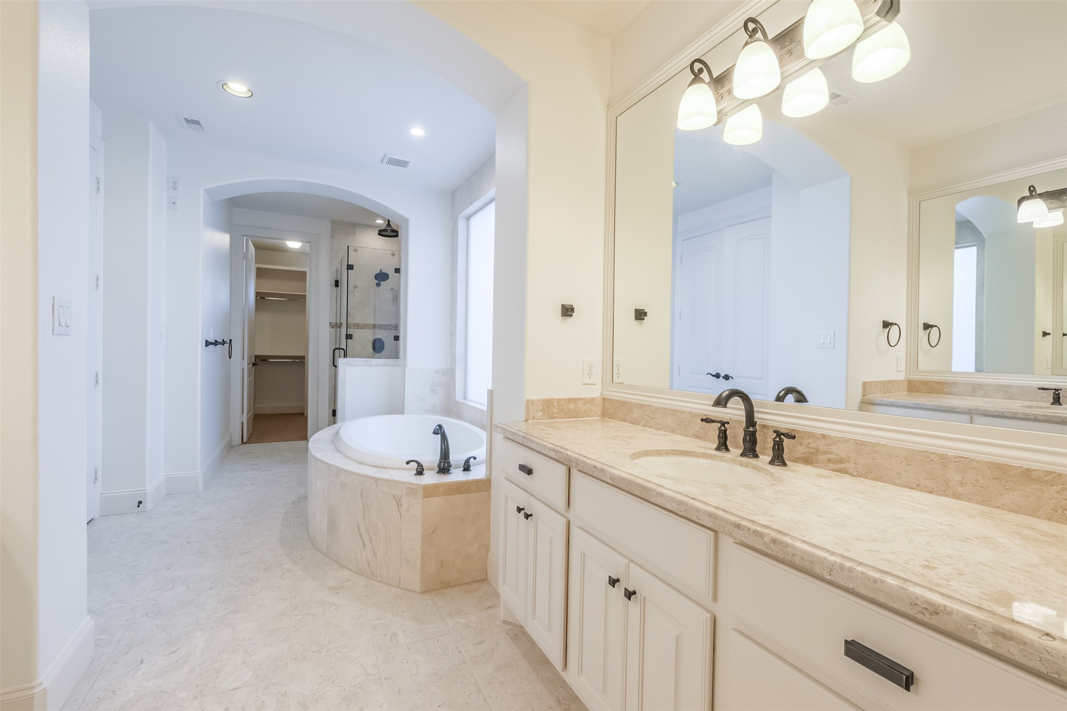 407 West Bell Street Houston, TX 77019 - Photo 42 of 49 a spacious bathroom with a double vanity sink mirror and bathtub