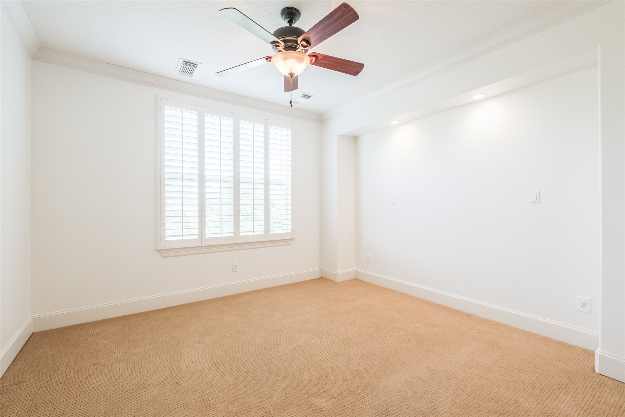 407 West Bell Street Houston, TX 77019 - Photo 44 of 49 an empty room with a window and a fan