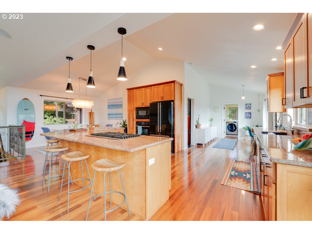 3250 P Street Washougal, WA 98671 - Photo 11 of 48 a very nice looking open dining room with kitchen island
