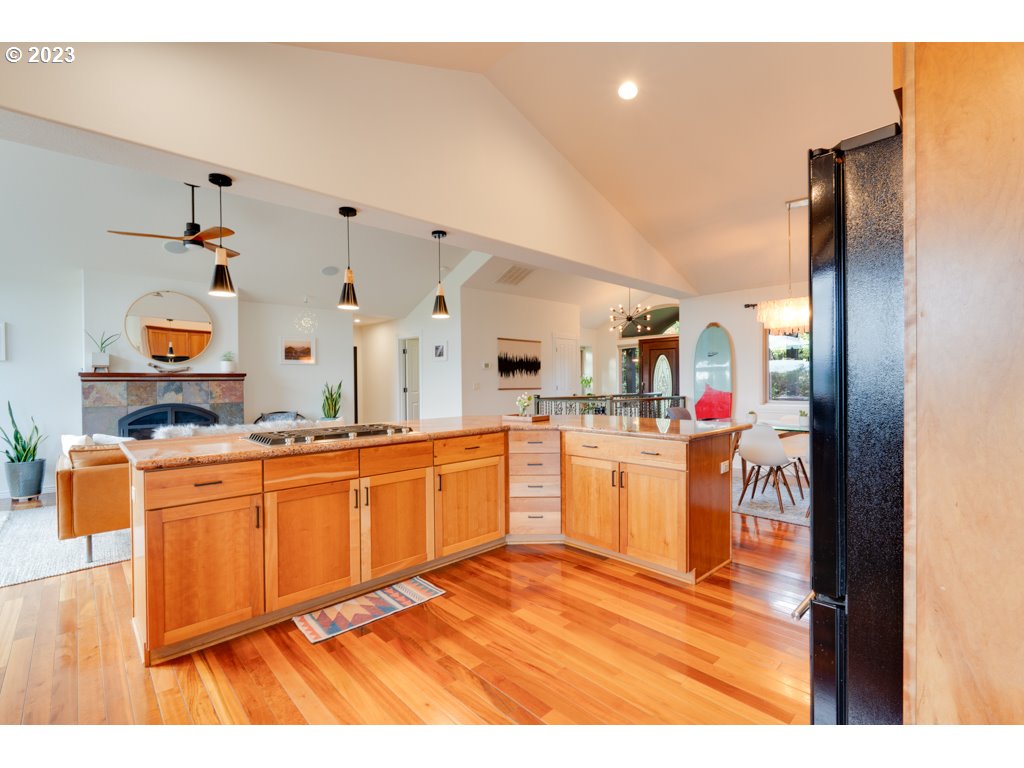 3250 P Street Washougal, WA 98671 - Photo 14 of 48 a open kitchen with stainless steel appliances granite countertop a sink and dishwasher with white cabinets