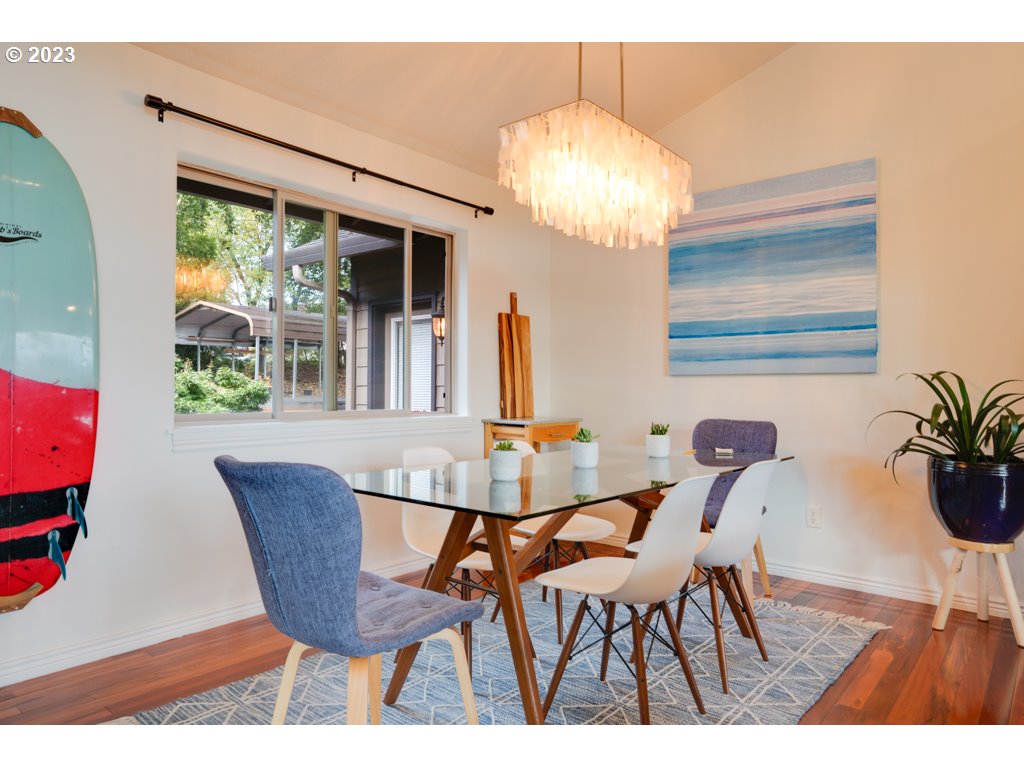 3250 P Street Washougal, WA 98671 - Photo 16 of 48 a view of a dining room with furniture and chandelier