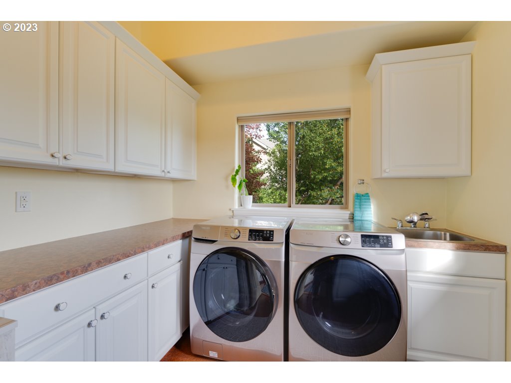 3250 P Street Washougal, WA 98671 - Photo 18 of 48 a utility room with sink dryer and washer
