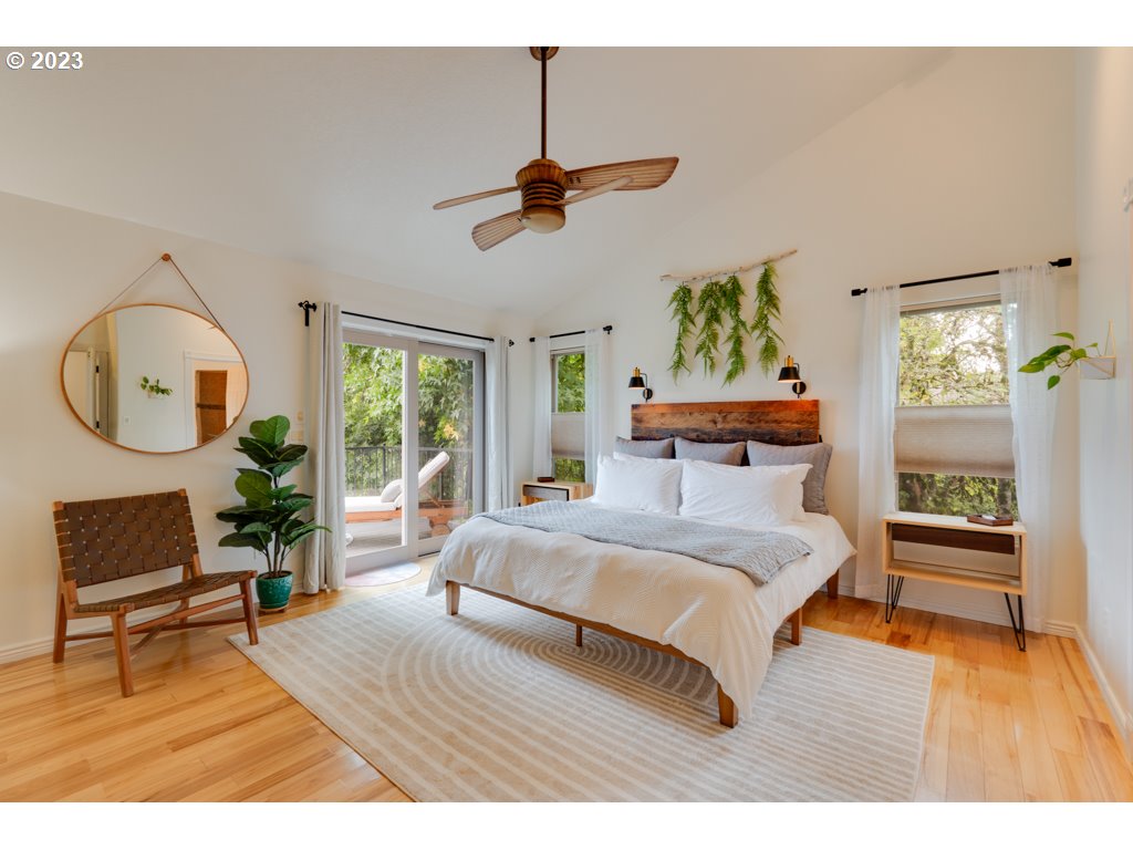 3250 P Street Washougal, WA 98671 - Photo 19 of 48 a bedroom with a bed a dresser with wooden floor