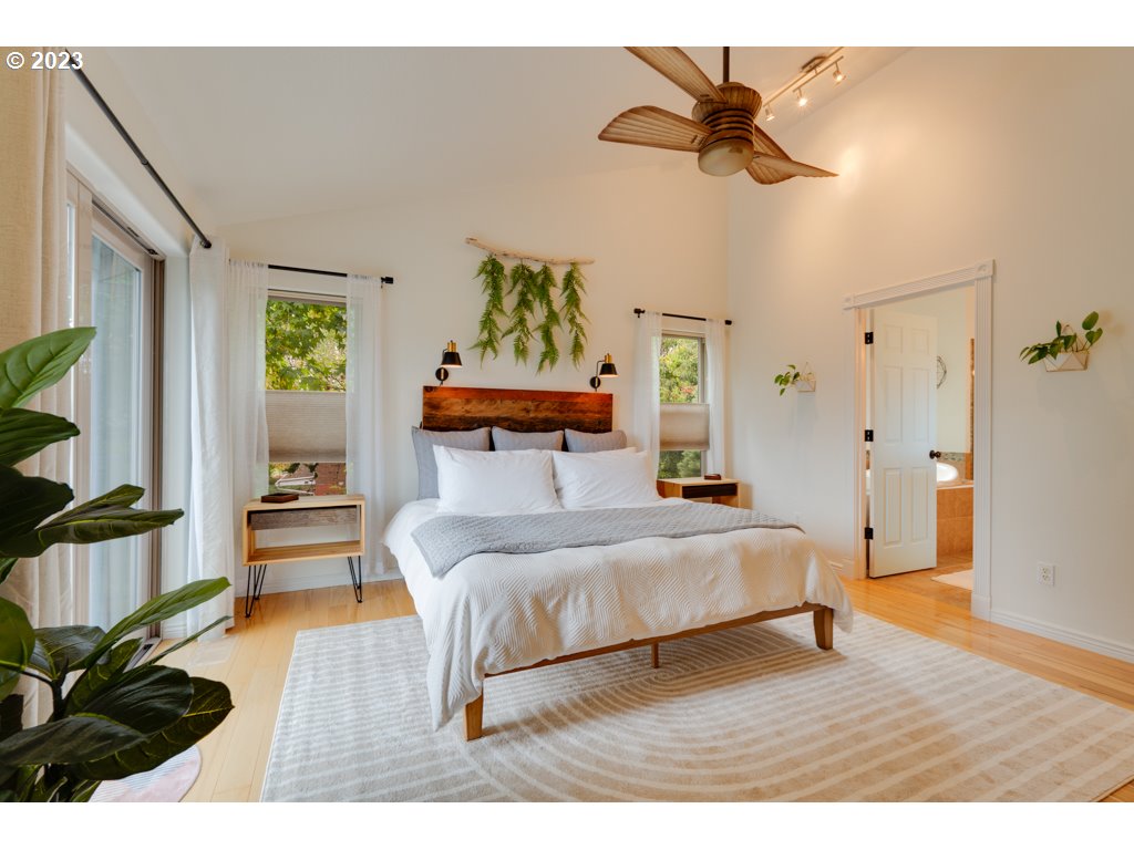 3250 P Street Washougal, WA 98671 - Photo 20 of 48 a bedroom with a bed and a chandelier