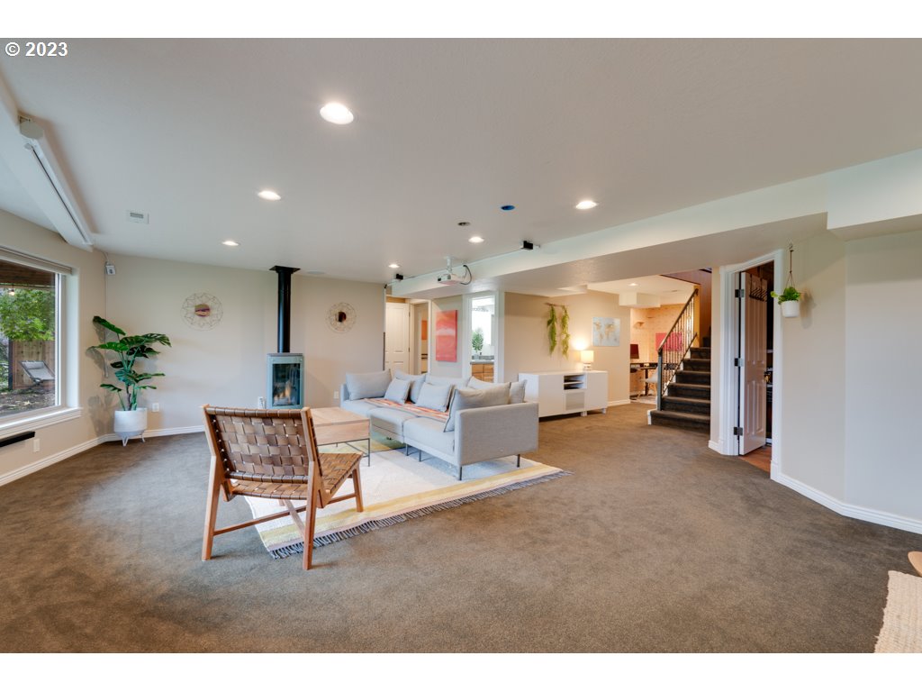 3250 P Street Washougal, WA 98671 - Photo 29 of 48 a living room with furniture and a wooden floor