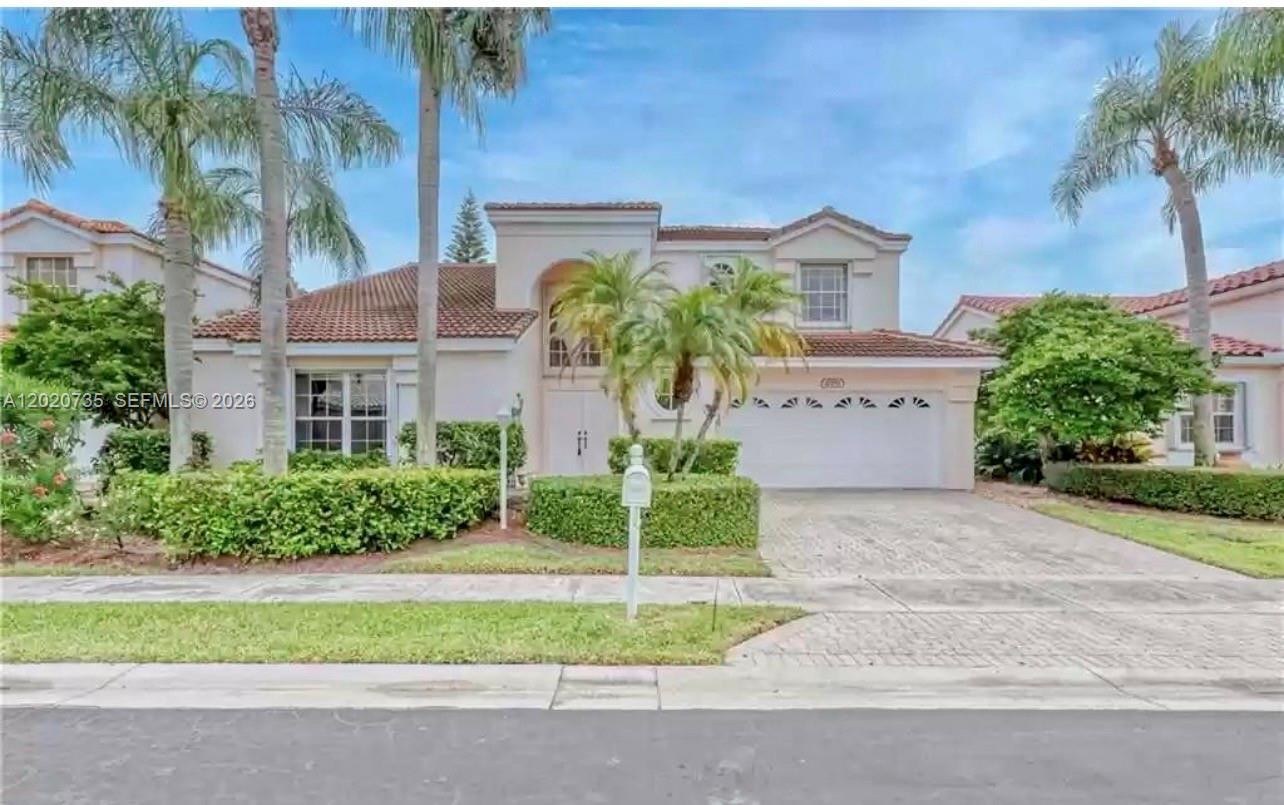 17244 Balboa Point Way Boca Raton, FL 33487 - Photo 65 of 66 a front view of a house with garden
