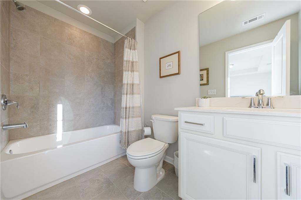 2002 Raven Way Atlanta, GA 30341 - Photo 11 of 27 a bathroom with a sink toilet and shower