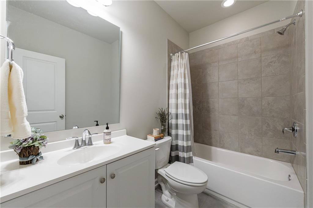 2002 Raven Way Atlanta, GA 30341 - Photo 13 of 27 a bathroom with a sink mirror toilet and bathtub