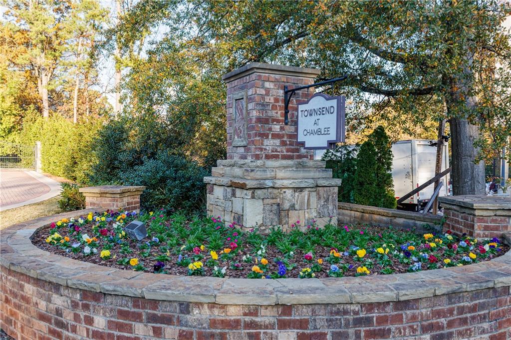 2002 Raven Way Atlanta, GA 30341 - Photo 27 of 27 a front view of a house with a yard and fountain