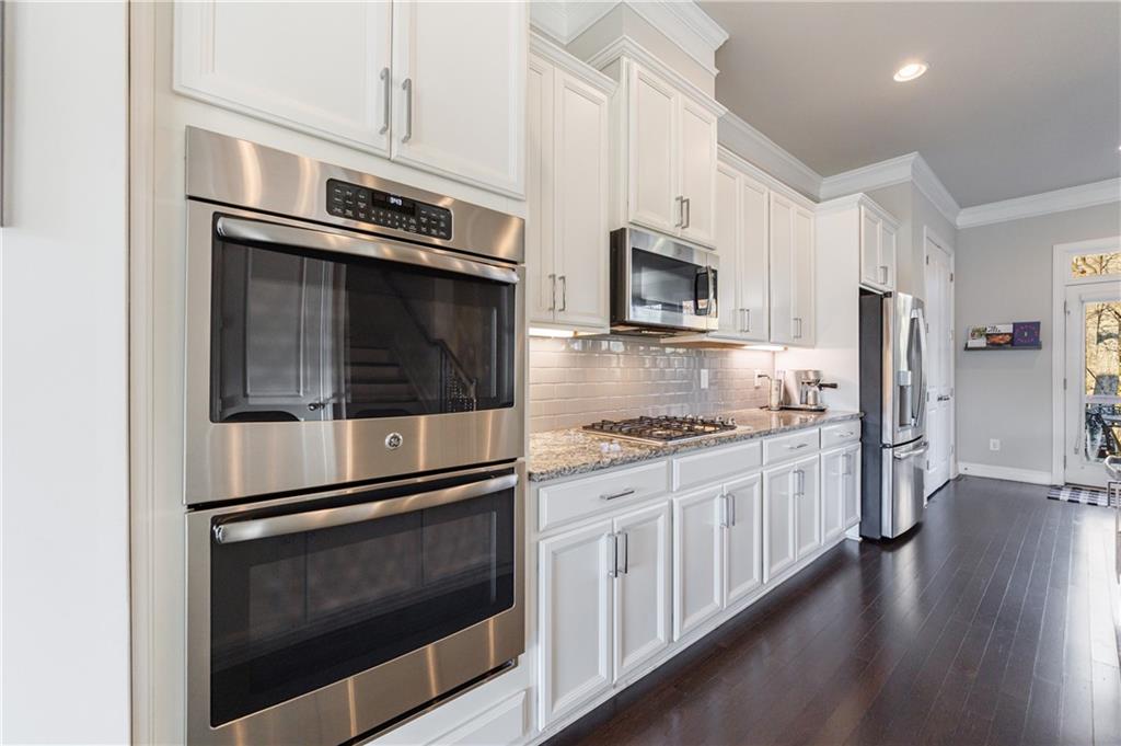 2002 Raven Way Atlanta, GA 30341 - Photo 3 of 27 a kitchen with stainless steel appliances granite countertop a stove microwave and refrigerator