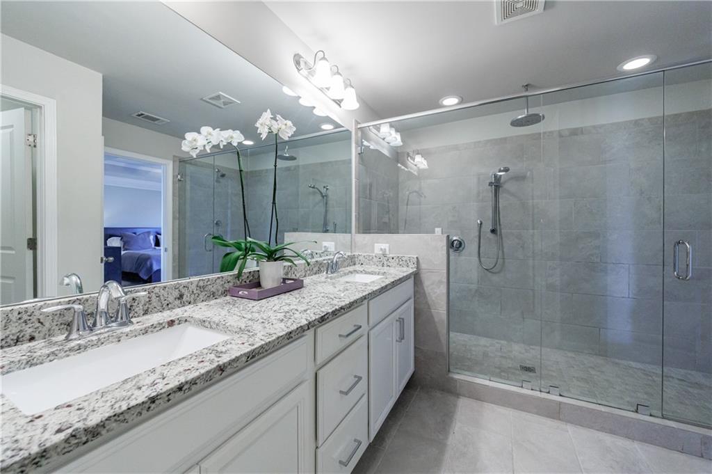 2002 Raven Way Atlanta, GA 30341 - Photo 8 of 27 a bathroom with a granite countertop sink shower and a mirror