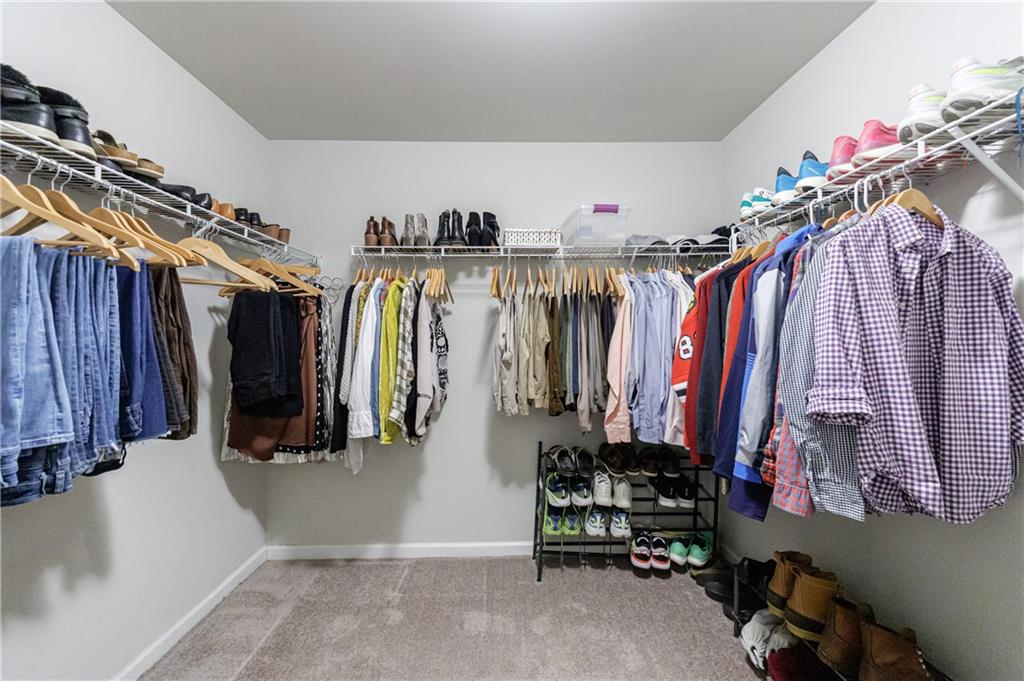 2002 Raven Way Atlanta, GA 30341 - Photo 9 of 27 a view of walk in closet with clothes and shoes