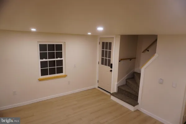 a kitchen with granite countertop a sink and cabinets