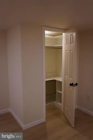 a view of a hallway with washer and dryer