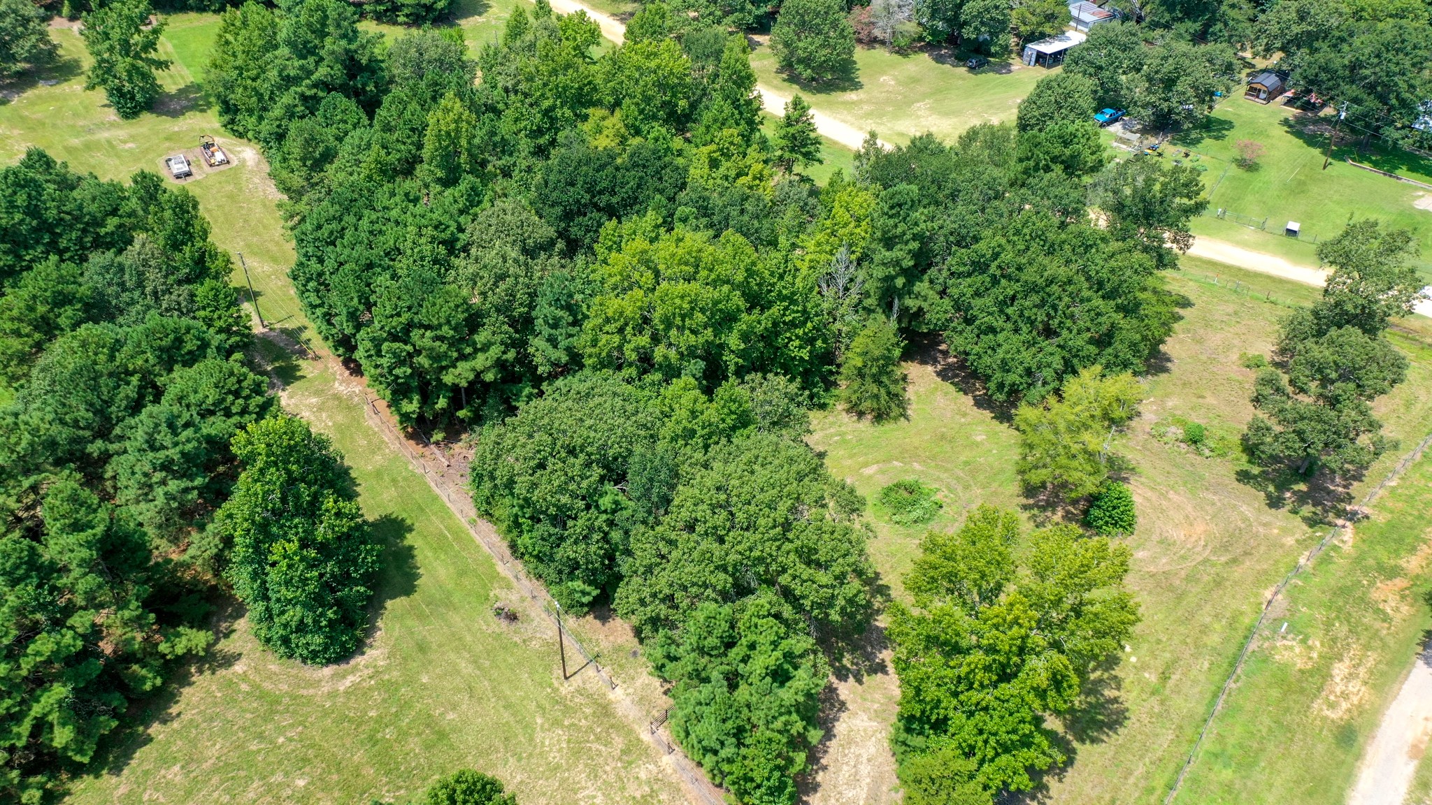 8374 Cattle Trail Road Midway, TX 75852 - Photo 14 of 16 an aerial view of residential houses with outdoor space and trees all around
