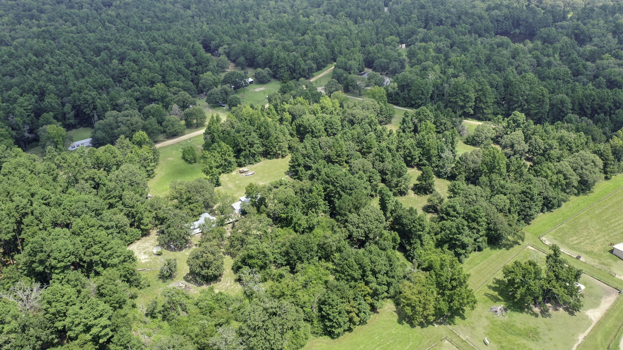 8374 Cattle Trail Road Midway, TX 75852 - Photo 3 of 16 an aerial view of residential house with outdoor space and trees all around