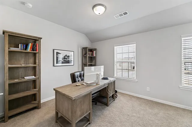 a living room with furniture and window