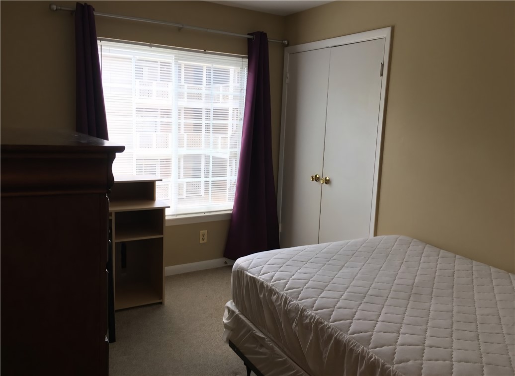 220 Elm Street, Unit 423 Clemson, SC 29631 - Photo 8 of 14 This cozy bedroom features ample natural light and convenient closet storage.