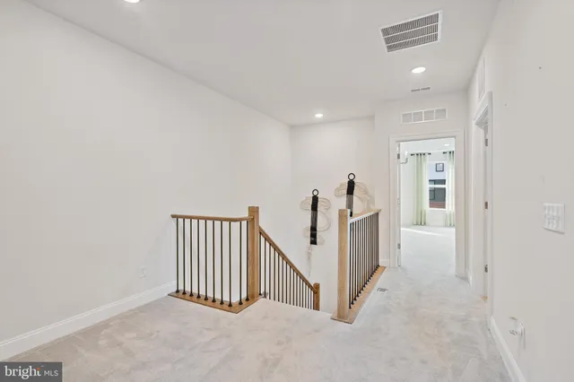 a view of a hallway with staircase
