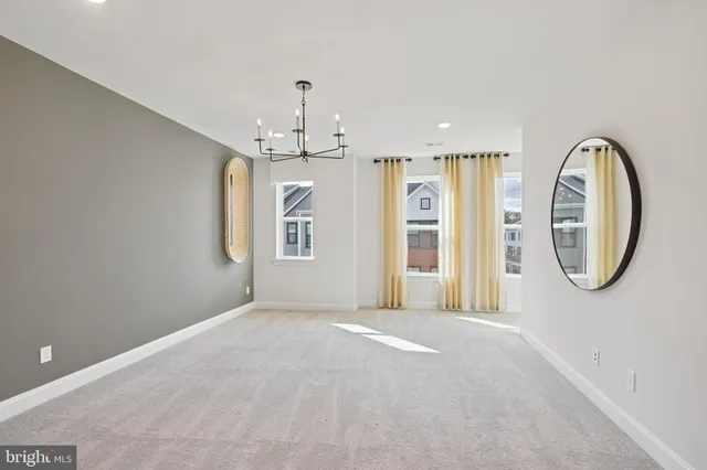 a view of a livingroom with wooden floor and window