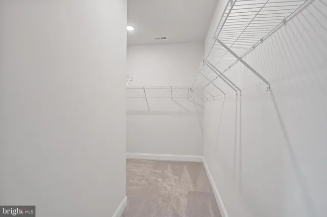 a view of a room with racks on the wall