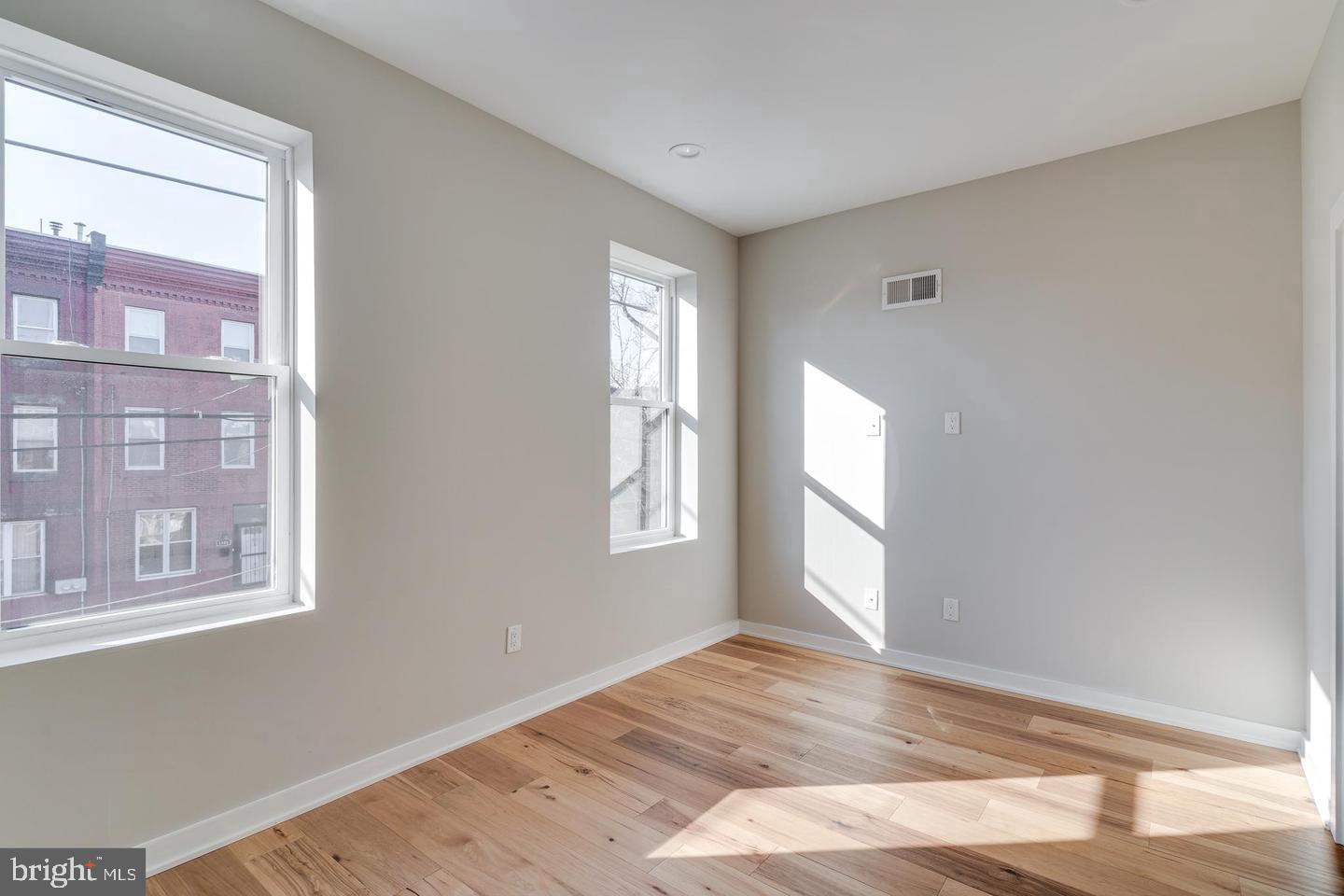 1503 North 29th Street Philadelphia, PA 19121 - Photo 15 of 27 a view of empty room with wooden floor and fan