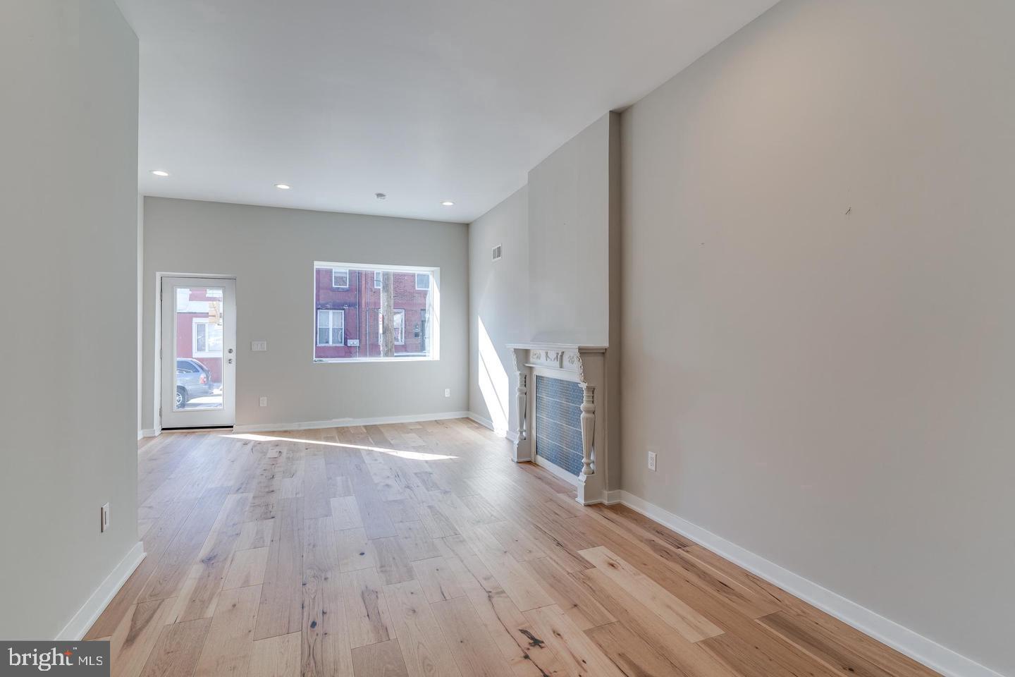 1503 North 29th Street Philadelphia, PA 19121 - Photo 3 of 27 wooden floor in an empty room with a window