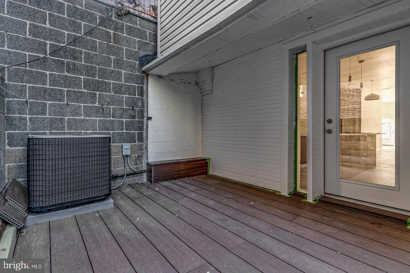 1503 North 29th Street Philadelphia, PA 19121 - Photo 4 of 27 a view of an empty room with wooden floor and a window
