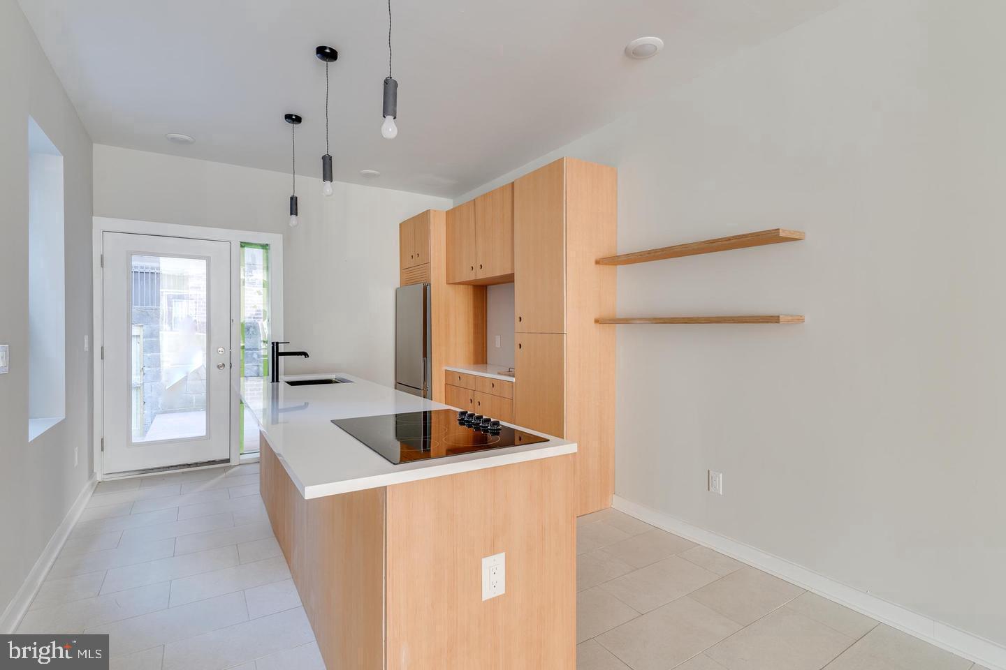 1503 North 29th Street Philadelphia, PA 19121 - Photo 6 of 27 a kitchen with refrigerator and cabinets