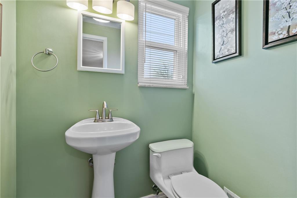 5140 Raintree Drive Pittsburgh, PA 15236 - Photo 12 of 26 a bathroom with a toilet sink and mirror