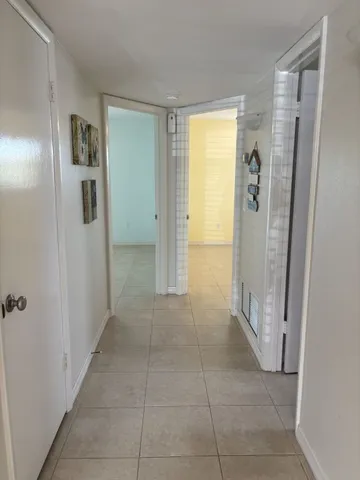 a bathroom with a glass door shower