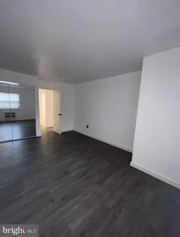 a view of a kitchen with a sink and dishwasher wooden floor