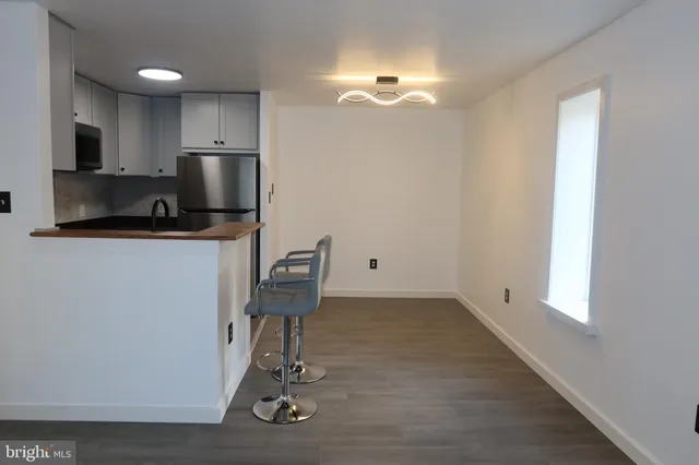 a view of kitchen with workspace and window