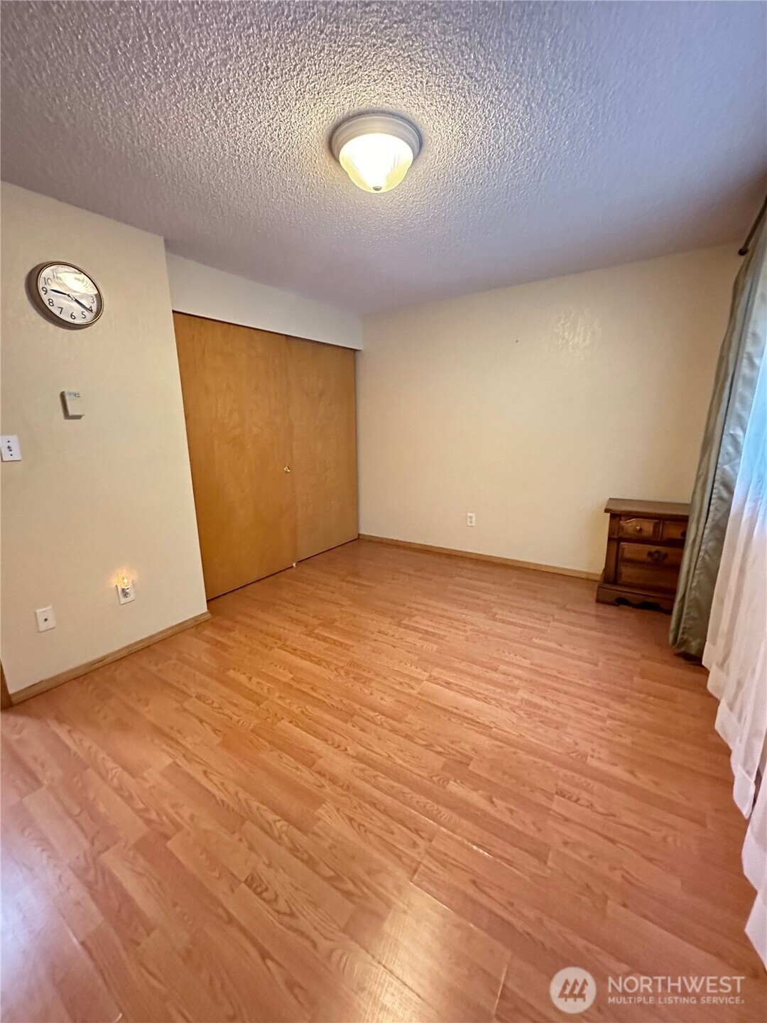 9105 1st Place Northeast, Unit 2 Lake Stevens, WA 98258 - Photo 13 of 13 a view of empty room with wooden floor