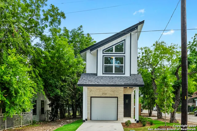 a house view with a garden space
