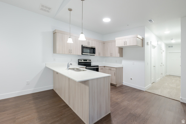 4661 Poplar Way, Unit R302 Mapleton, UT 84664 - Photo 12 of 17 Kitchen featuring light wood finish cabinets, a peninsula, stainless steel appliances, dark wood-type flooring, and decorative light fixtures