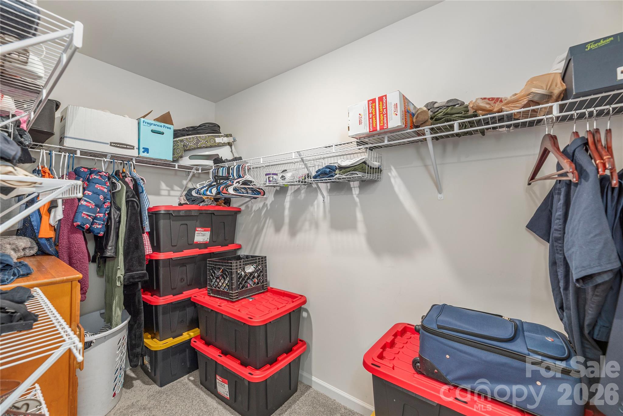 8 Madelyn Drive Clyde, NC 28721 - Photo 22 of 43 a view of walk in closet with clothes and shoes