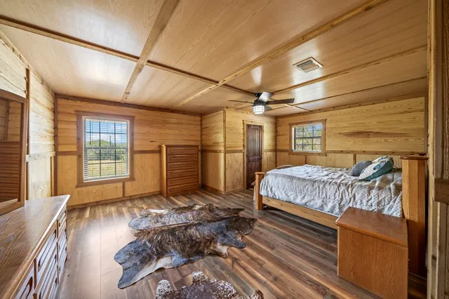 a bedroom with furniture and a window