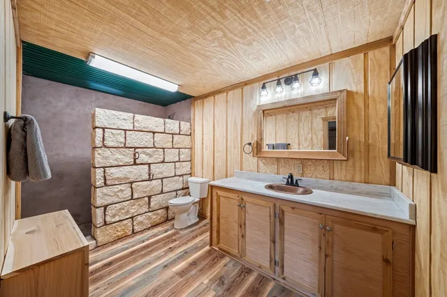 a bathroom with a sink a double vanity and a mirror