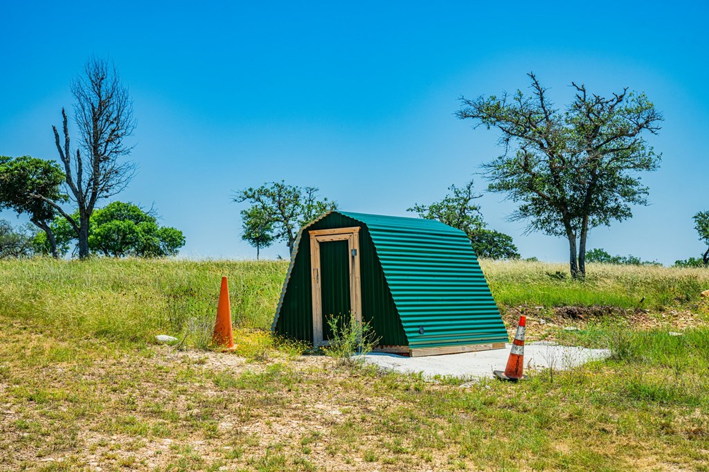1316 Highway 39 Ingram, TX 78025 - Photo 17 of 27 a front view of a house with a yard