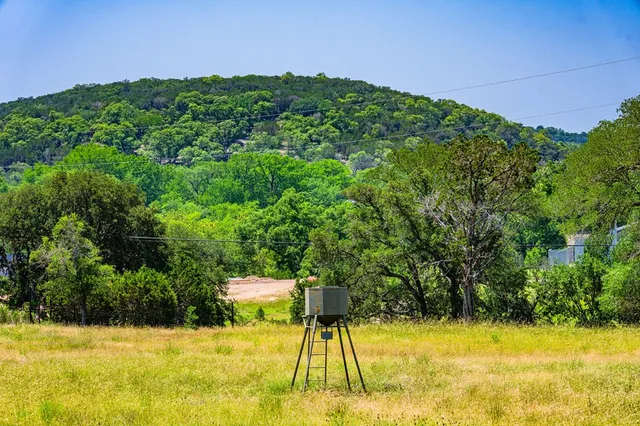 a view of a swimming pool with an outdoor space and seating area