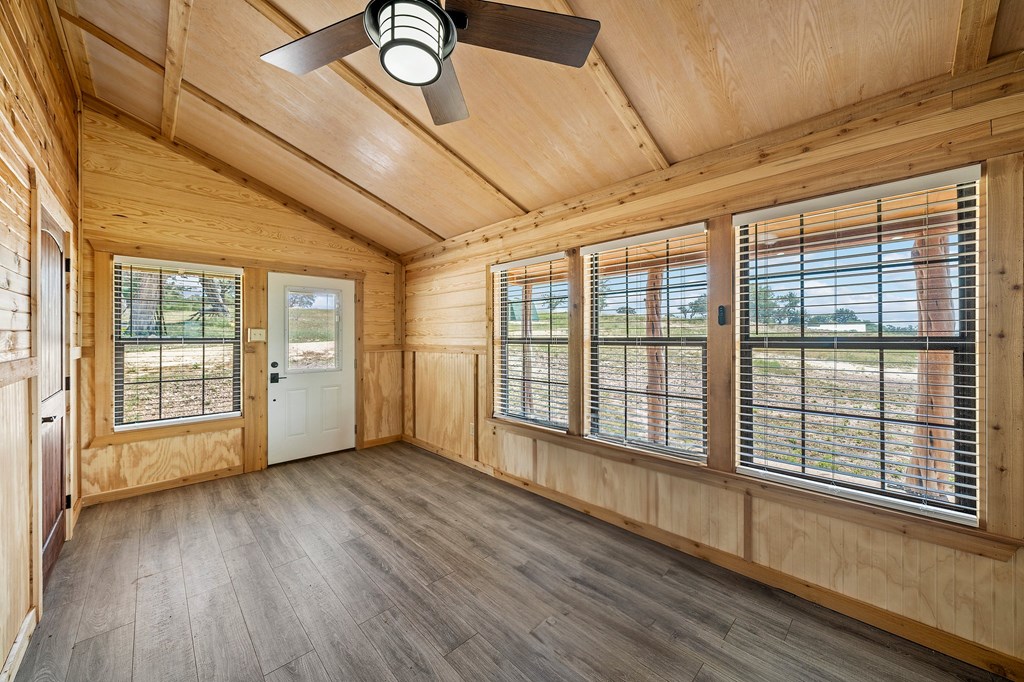 1316 Highway 39 Ingram, TX 78025 - Photo 10 of 27 a view of an empty room with wooden floor and a window
